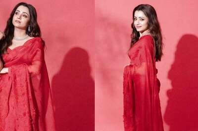 Actress Trisha Krishnan Personifies Elegance In Red Saree At Leo Success Meet