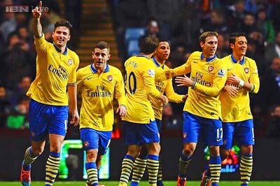 Arsenal survive late scare at Villa to go top