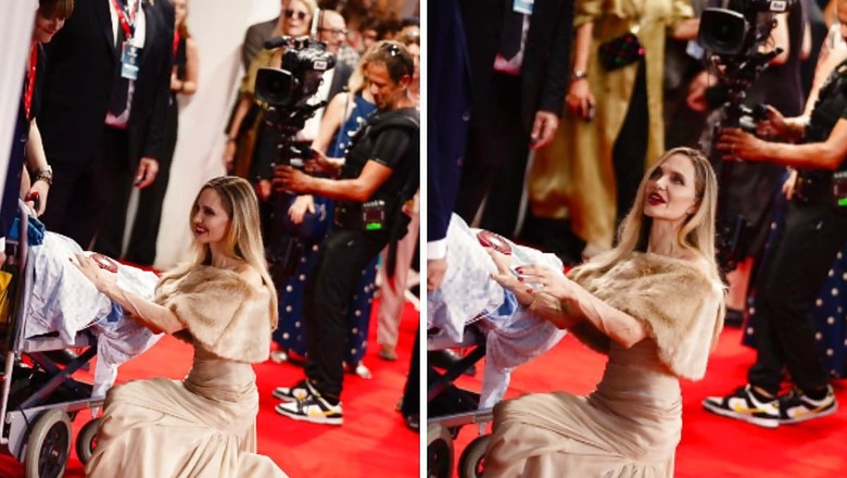 Angelina Jolie Kneels Down To Meet Special Fan At Maria Premiere