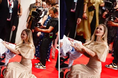 Angelina Jolie Kneels Down To Meet Special Fan At Maria Premiere