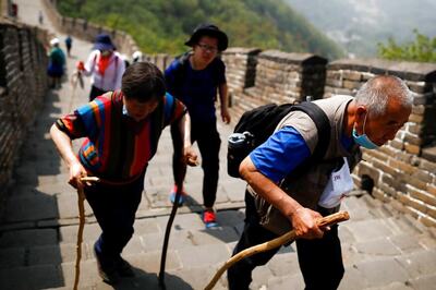 Tourists Trickle Back to Village by China's Great Wall as Coronavirus Curbs Relaxed