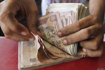 Rupee gains 12 paise against dollar, ends at 61.50