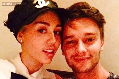 Miley Cyrus poses for a Valentine's Day selfie with beau Patrick Schwarzengger