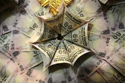 Rupee hits new record low, near key 56-level