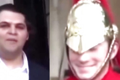 Watch: Rare Moment Shows Buckingham Palace Visitor Making A Royal Guard Laugh