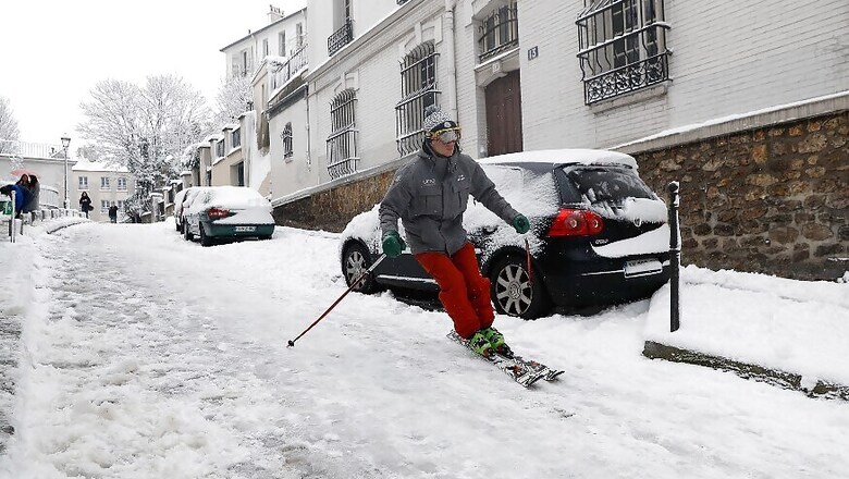 Skiers Take To Streets As Paris Comes Under Heavy Snows