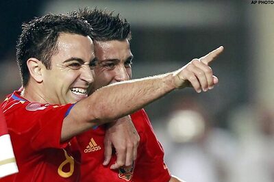 Spain rely on Xavi's midfield magic