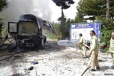 Pakistan militants blast bus, attack hospital; at least 21 dead