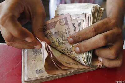 Rupee closes lower by 12 paise at 62.68 against dollar
