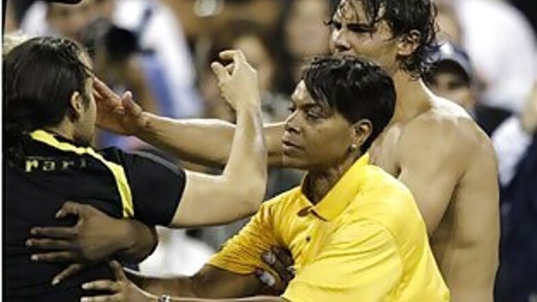 Male fan invades court, kisses shirtless Nadal at US Open