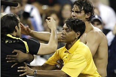 Male fan invades court, kisses shirtless Nadal at US Open