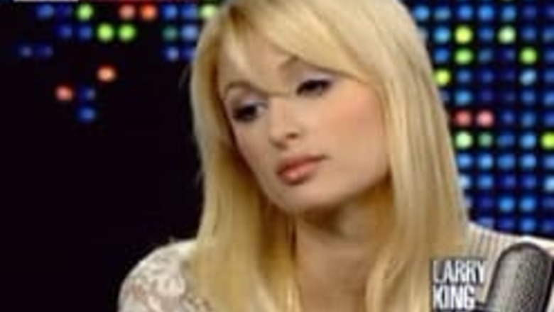 Paris Hilton strips to undies and leather jacket