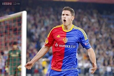 Basel, Lyon hold nerve to reach Champions League play-offs