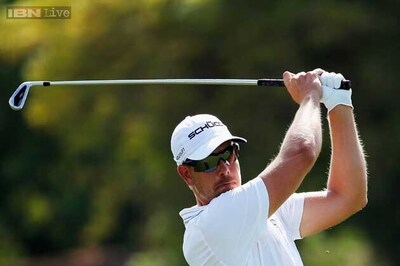 Dubai leader Stenson aims to hold off Poulter