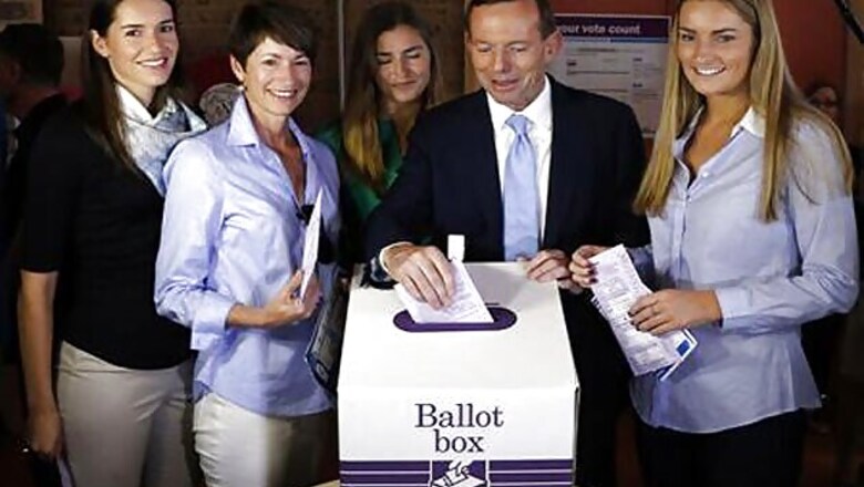 Conservative leader Tony Abbott expected to win Australian election as polls begin