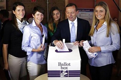 Conservative leader Tony Abbott expected to win Australian election as polls begin