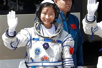 China sends first woman into space