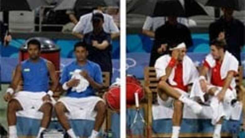 Rain stops Paes-Bhupathi and Federer-Wawrinka match