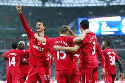 Wigan sink Millwall to reach first FA Cup final