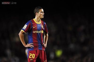 Barcelona's Afellay out for 4 months after leg surgery