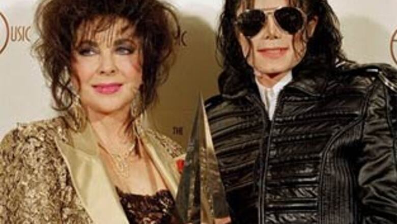 'Devastated' Liz Taylor grieves for MJ in private