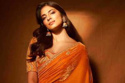Malavika Mohanan Exudes Elegance in Mustard-Orange Saree This Dussehra