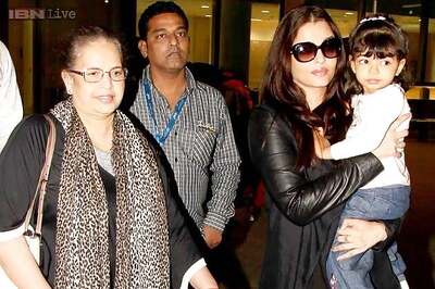 Snapshot: Aishwarya Rai and Abhishek Bachchan return from London vacation with baby Aaradhya
