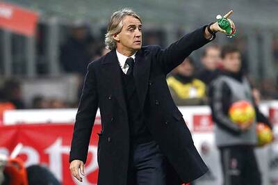 Milan Derby defeat hurts Mancini; slams officials, argues with TV presenter