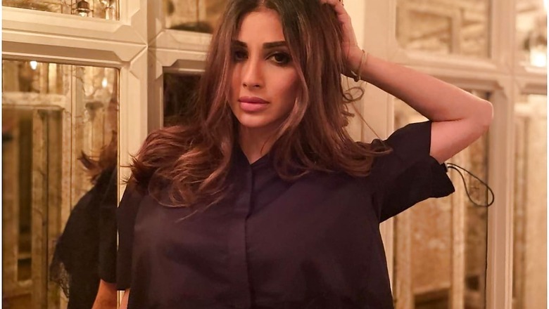 Mouni Roy Looks Mesmerising in Lacy Black Crop Top Posing in a Mirrored Hallway