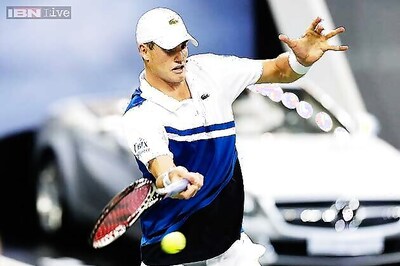 John Isner rallies to beat Santiago Giraldo in Shanghai