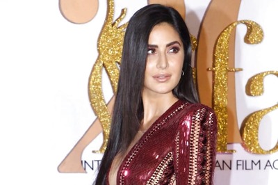 Katrina Kaif Sizzles at the IIFA Red Carpet in a Maroon Gown with Thigh High Split