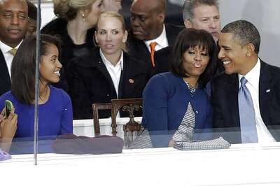 Snapshot: Awww! Sasha clicks photos of Michelle and Barack Obama kissing