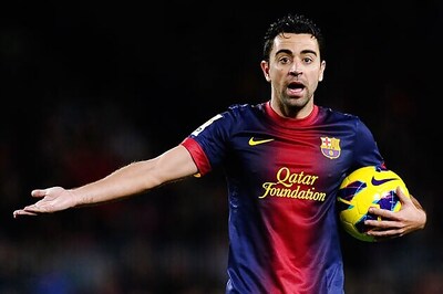 Xavi Hernandez signs through 2016 with Barcelona