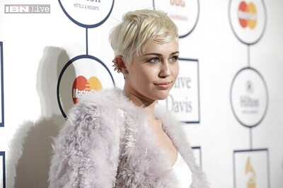 After twerking, Miley Cyrus spits on the audience