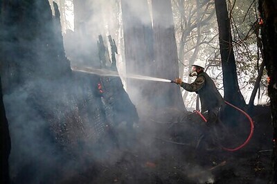 Neighbors With Hoses Target Fires As Crews Urge Them To Stop