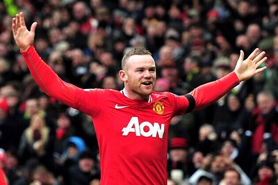 In-form Rooney leads Man United title charge
