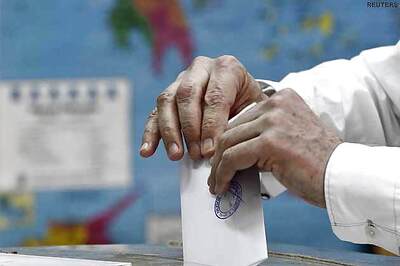 World waits with bated breath as Greece votes