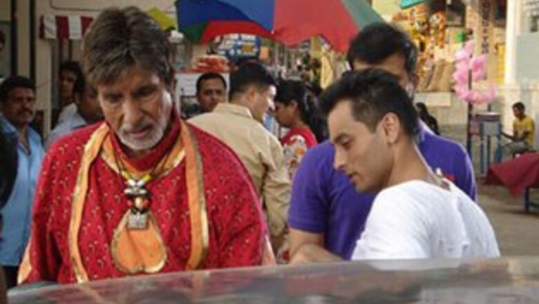 In Pics: Big B sings, dances, sells hair oil