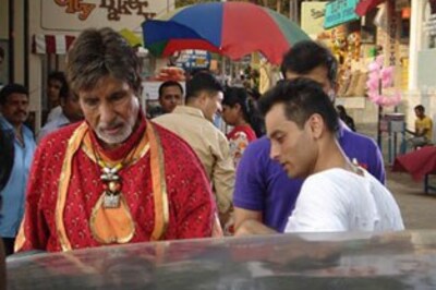 In Pics: Big B sings, dances, sells hair oil