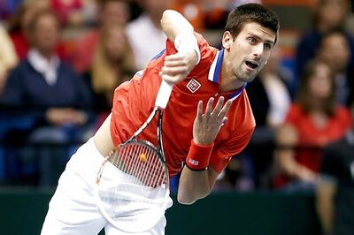 Djokovic canters as Federer makes winning return